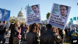 Demonstrators rally at the U.S. Capitol to protest spying on Americans by the National Security Agency in Washington on Oct. 26, 2013. (AP) 