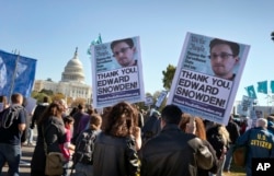 Demonstrators rally at the U.S. Capitol to protest spying on Americans by the National Security Agency in Washington on Oct. 26, 2013. (AP)