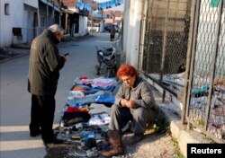 A vendor sells second-hand items in Suto Orizari, a district with Europe's largest Roma communities, Macedonia, Dec. 2, 2016.