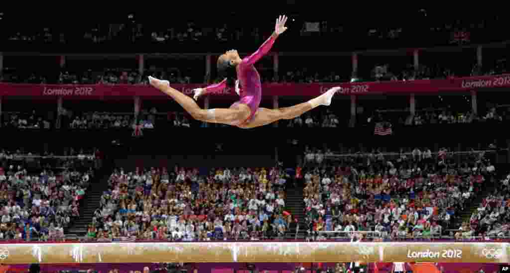 U.S. gymnast Gabrielle Douglas performs on the balance beam during the artistic gymnastics women's individual all-around competition.