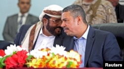 Yemen's Vice President and Prime Minister Khaled Bahah (R) listens to the governor of the northern province of Marib, Sultan al-Arada, during a meeting with local officials in Marib, Yemen, Nov. 22, 2015.