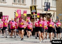 FILE - People attend a protest at Senate Square to support women's reproductive rights in Helsinki, Finland, July 16, 2018.
