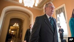 Senate Majority Leader Mitch McConnell walks to the chamber where he offered a tribute to the late Supreme Court Justice Antonin Scalia, on Capitol Hill in Washington, Feb. 22, 2016.