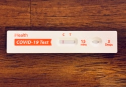 A negative result is shown from a take-home Covid-19 test kit on January 10, 2022 in Los Angeles, California,