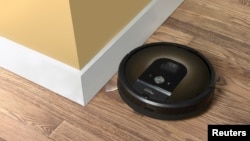 An iRobot Roomba 980 is seen in this undated handout photo. 