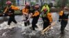 Search and Rescue workers from New York rescue a man from flooding caused by Hurricane Florence in River Bend, North Carolina, U.S. in this Sept. 14, 2018 handout photo. 