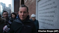 Harvard University professor Charles Lieber leaves the Moakley Federal Courthouse with his wife Jennifer, right, in Boston, Thursday, Jan. 30, 2020.