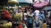 Women sell vegetables and other food in a market on World Food Day in Lagos, Nigeria, Tuesday, Oct. 16, 2012. One in eight people around the world goes to bed hungry every night, according to the United Nations.