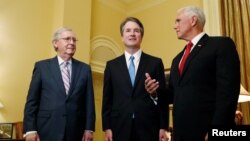 U.S. Senate Majority Leader Mitch McConnell greets Supreme Court nominee Judge Brett Kavanaugh and Vice President Mike Pence for a meeting in his office at the U.S. Capitol on Capitol Hill in Washington, July 10, 2018. 