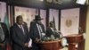 South Sudan President Salva Kiir (C), flanked by former rebel leader Riek Machar (L) and other government officials, addresses a news conference at the Presidential State House in Juba, South Sudan, July 8, 2016. 