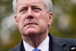 FILE: White House chief of staff Mark Meadows speaks with reporters outside the White House, Oct. 26, 2020, in Washington.