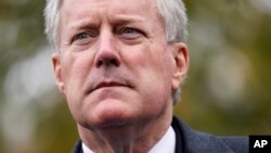 FILE: White House chief of staff Mark Meadows speaks with reporters outside the White House, Oct. 26, 2020, in Washington.