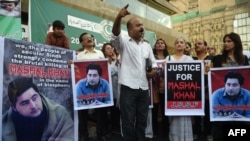 FILE - Pakistani demonstrators take part in a protest over the killing of journalism student Mashal Khan in Karachi, April 22, 2017. Pakistan police arrested 22 people after the lynching of the student accused of blasphemy.