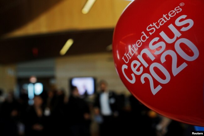 FILE - Balloons decorate an event for community activists and local government leaders to mark the one-year-out launch of the 2020 Census efforts in Boston, April 1, 2019.