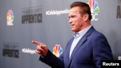 Host Arnold Schwarzenegger poses after a panel for "The Celebrity Apprentice" in Universal City, California, Dec. 9, 2016. 