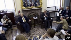 Senators Charles Schumer, left, and Bob Casey talk to the media at the Capitol in Washington December 17, 2011, after the U.S. Senate voted to fund government operations through the end of the current fiscal year, which ends September 30, 2012.