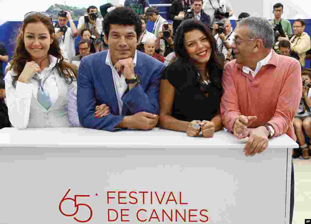 From left, actors Menna Shalaby, Bassem Samra, Nahed El Sebai, and director Yousry Nasrallah pose during a photo call for After the Battle at the 65th international film festival, in Cannes, France, May 17, 2012.