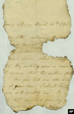 This undated photo provided by The Papers of Abraham Lincoln, a project administered by the Abraham Lincoln Presidential Library and Museum in Springfield, Illinois, shows a letter fragment found inside a wall at Abraham Lincoln's Springfield home.