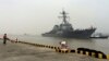 Chinese Navy personnel stand guard as guided missile destroyer USS Stethem arrives at the Shanghai International Passenger Quay for a scheduled port visit in Shanghai, China, Nov. 16, 2015. 