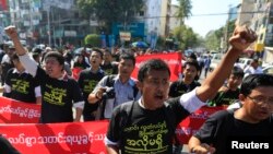 FILE - Reporters shout as they march demanding broader press freedom in Yangon, Myanmar, Jan. 7, 2014.