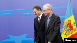 FILE - European Council President Herman Van Rompuy (R) is seen with Moldova's Prime Minister Vlad Filat in Brussels December 12, 2011.