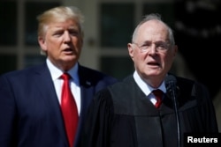 FILE - U.S. President Donald Trump listens as Justice Anthony Kennedy speaks before swearing in Judge Neil Gorsuch as an Associate Supreme Court Justice at the White House in Washington, April 10, 2017.