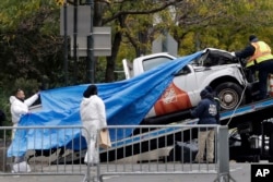The truck used in the bike path attack is removed from the crime scene, Nov. 1, 2017, in New York.
