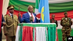 FILE - Burundi's President Pierre Nkurunziza is seen being sworn in for a third term at a ceremony in the parliament in Bujumbura, Burundi, Aug. 20, 2015.
