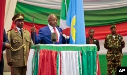 FILE - Burundi's President Pierre Nkurunziza is sworn in for a third term at a ceremony in the parliament in Bujumbura, Burundi, Thursday, Aug. 20, 2015.