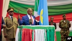 FILE - Burundi's President Pierre Nkurunziza is sworn in for a third term at a ceremony in the parliament in Bujumbura, Burundi, Thursday, Aug. 20, 2015. 