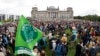 Activist gather for a Fridays for Future global climate strike in front of the parliament building in Berlin, Germany, Sept. 24, 2021. 