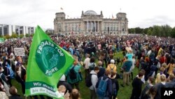Activist gather for a Fridays for Future global climate strike in front of the parliament building in Berlin, Germany, Sept. 24, 2021. 