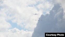 A U.S. KC135 refueling tanker jet and two A-10 Warthog fighters, flanked by a pair of British Royal Air Force Eurofighter Typhoon FGR4 jets, cruise over Tallin, Estonia. They are taking part in the Operation Atlantic Resolve Training exercise with Estonian, Lithuanian and Latvian forces. (Photo courtesy of Pat Pound)