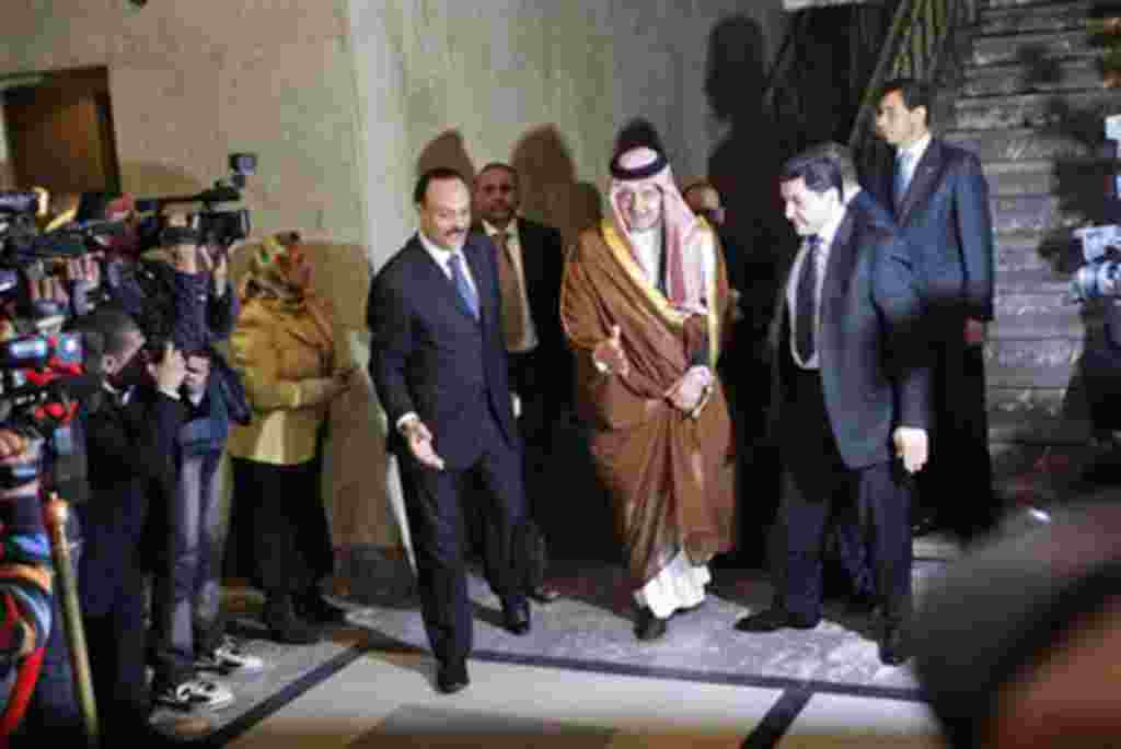 Saudi Arabian Foreign Minister Saud al-Faisal, center, arrives to attend an Arab League's emergency meeting in Cairo, March 12, 2011