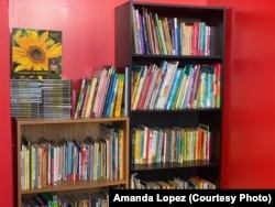 Books at Prince Cuts Barbershop, Lexington, KY. Kids keep the book after reading to a barber.