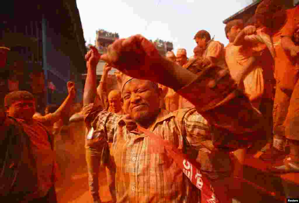 Devotees celebrate &quot;Sindoor Jatra&quot; vermillion powder festival at Thimi, near Kathmandu. The festival is celebrated to mark the Nepalese New Year and the beginning of spring season.
