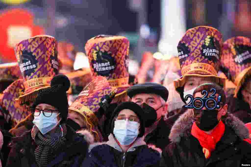 People attend the New Year&#39;s Eve celebrations in Times Square, as the Omicron coronavirus variant continues to spread, in the Manhattan borough of New York City, Dec. 31, 2021.