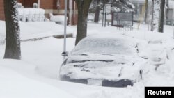 Badai musim dingin menimpa Iowa (20/12), memicu angin kencang dan hujan salju yang tebal. (AP)