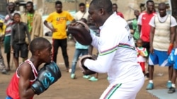 Boxer Tijani Abdulazeez, popularly known as TJ, 15, trains with his father, Abdulfathi Abdulazeez, at an outdoor boxing gym in Adura playground, in Lagos, Nigeria. REUTERS/Temilade Adelaja