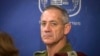 FILE - In this July 31, 2014 file photo, then-Chief of General Staff of the Israel Defense Forces Lt. Gen. Benny Gantz attends a Cabinet meeting at the Defense Ministry, in Tel Aviv, Israel.