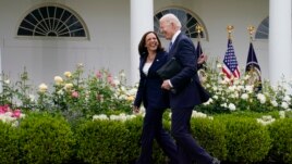 President Joe Biden walks with Vice President Kamala Harris after speaking on updated guidance on face mask mandates and COVID-19 response, in the Rose Garden of the White House, Thursday, May 13, 2021, in Washington. (AP Photo/Evan Vucci)