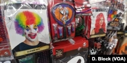 A clown wig and other accessories are seen at a costume shop.