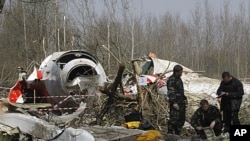 Russian investigators work near the wreckage of the Polish presidential plane, that crashed just outside the Smolensk airport, western Russia, April 11, 2010