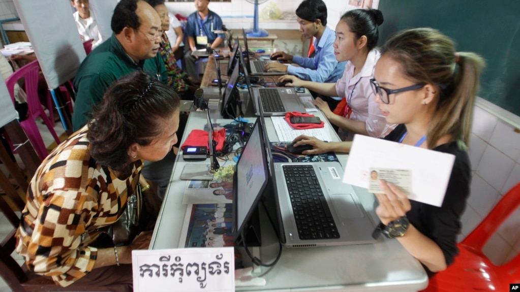 Cambodians sit for registering their names during a voter registration process of the National Election Committee (NEC) in Phnom Penh, Cambodia, Thursday, Sept. 1, 2016. NEC started its three-month-long voter registration in the day for the next general election scheduled for July 2018. (AP Photo/Heng Sinith)