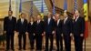 U.S. Secretary of State Kerry poses for a photo with officials from Moldova after their meeting in Chisinau, Moldova, on December 4, 2013.