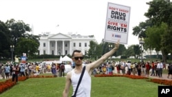 Vincent Leclercq of France demonstrates in front of the White House in Washington as the AIDS conference continues in Washington, July 24, 2012.