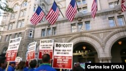 FILE - Hundreds protest against Donald Trump at the opening of the International Trump Hotel at the Old U.S. Post Office Building in Washington, D.C., Oct. 26, 2016.