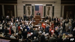 In this image from video provided by House Television, House Speaker Paul Ryan stands at the podium as he brings the House into session Wednesday night, June 22, 2016, in Washington.