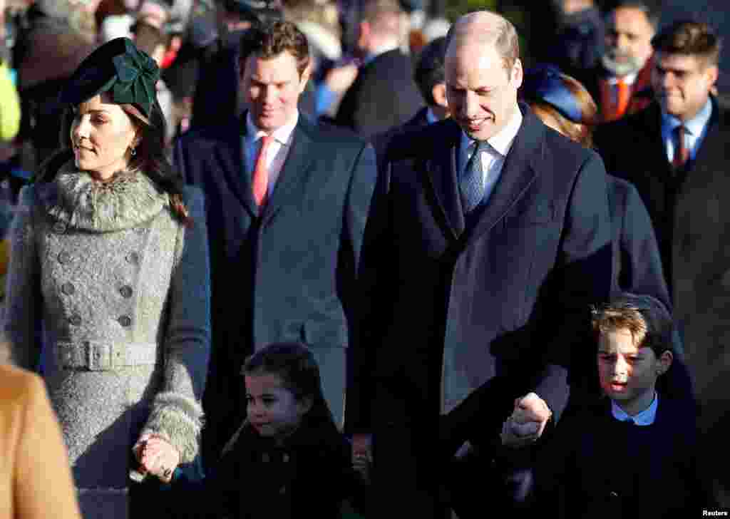 Britain&rsquo;s Prince William, Catherine, Duchess of Cambridge, Prince George and Princess Charlotte arrive at St. Mary Magdalene&#39;s church for the Royal Family&#39;s Christmas Day service on the Sandringham estate in eastern England.