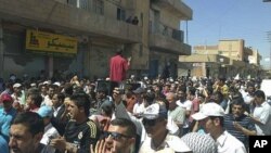 Syrians protest against President Bashar al-Assad after Friday prayers in the city of Amude, August 26, 2011.